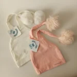 کلاه تک نوزادی تریکو پوم دار مدل عروسکی4 - تصویر 8